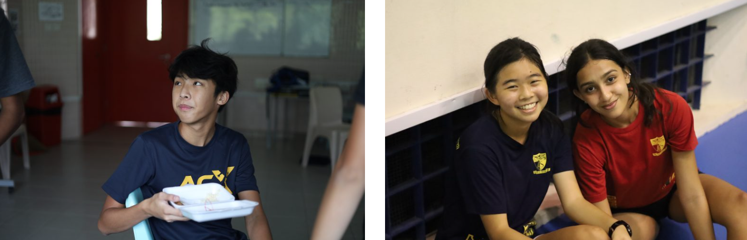 A teen boy holds a food container indoors; two smiling girls in navy and red shirts pose together nearby.